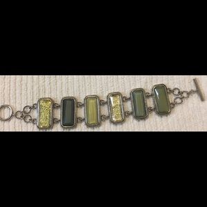 Different shades of green, yellow and silver bracelet